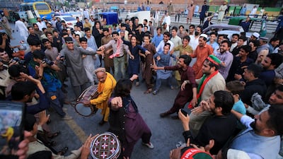 Supporters of former Pakistani prime minister Imran Khan celebrate in Peshawar after the country's Supreme Court ordered his release. EPA