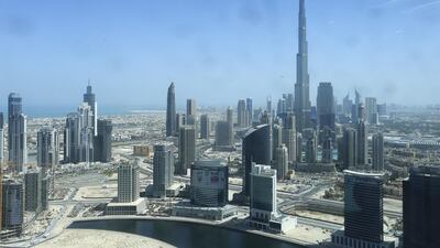 Dubai’s booming economy acts as a financial cash cow for the government by way of dividends from government-related enterprises, business licences and other commercial charges. Sarah Dea / The National