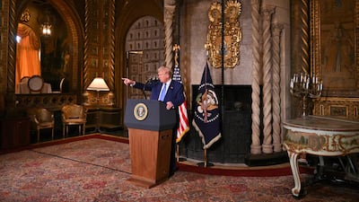 US President Donald Trump takes questions during the signing of executive orders at his Mar-a-Lago resort in Palm Beach, Florida, on February 18. AFP