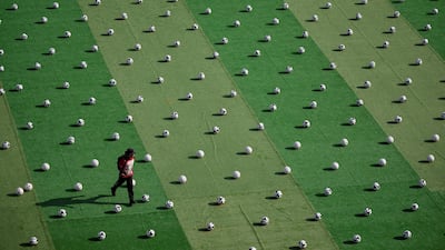 Balls laid out at Zocalo square in Mexico City, before a new Guinness World Record attempt for the largest football coaching session ever held. AFP