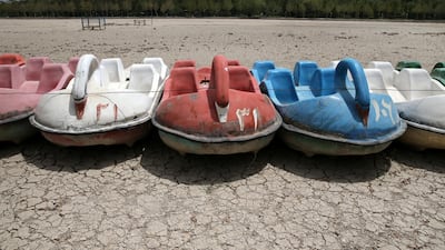 A row of paddle boats sit on the parched Zayandeh Roud riverbed, in Isfahan, on July 10, 2018. AP Photo