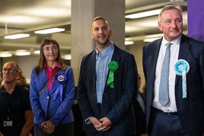 Green Party candidate Zack Polanski, centre, attends the count declaration in the Holborn and St Pancras by-election. Getty Images