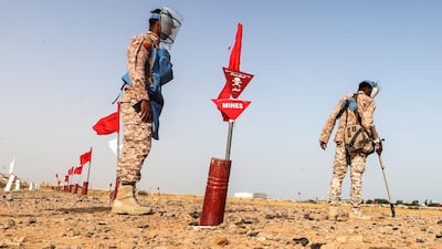 Yemeni forces sweep for mines. AFP