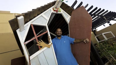 Atef Ali’s hobby of turning old furniture into new pieces is becoming popular with his neighbours. Chris Whiteoak for The National