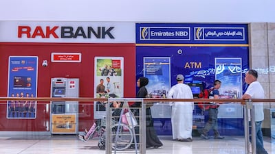 Many UAE banks have introduced new financial relief measures amid the coronavirus outbreak in line with the central bank's Dh100 billion economic stimulus package. Victor Besa / The National