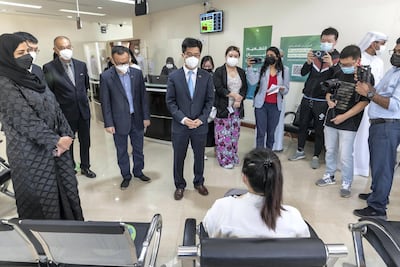 Li Xuhang, China’s consul general in Dubai, meets citizens receiving the Covid-19 vaccine. Antonie Robertson / The National