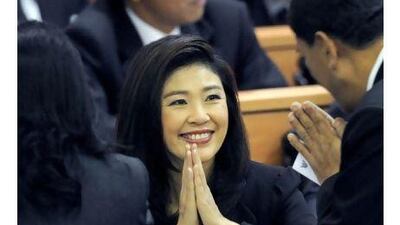 The Thai prime minister-in-waiting, Yingluck Shinawatra, gives a traditional greeting to members of parliament as they attend the vote for a parliamentary speaker in Bangkok yesterday. Pornchai Kittiwongsakul / AFP Photo