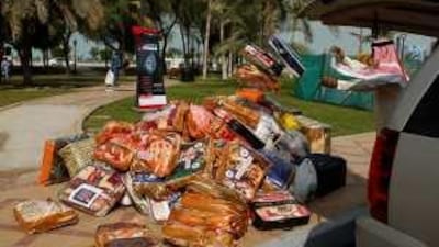 Blankets to be sent Palestinians in the Gaza Strip are unloaded at tents set up by the Red Crescent Authority on the Corniche in Abu Dhabi.