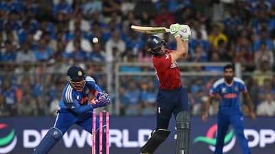England's Jos Buttler is bowled by Varun Chakravarthy of India for 25. Getty Images