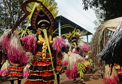 Kummatti Kali mask dancers perform as part of Onam festival celebrations. AFP