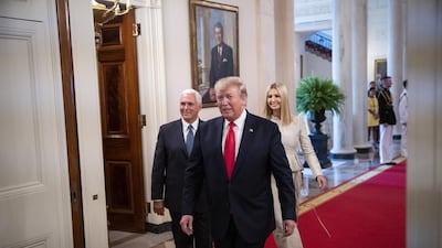 US President Donald Trump, center, arrives with US Vice President Mike Pence, left, and Ivanka Trump, assistant to Trump, for the "Pledge to America's Workers" event at the White House in Washington. Bloomberg