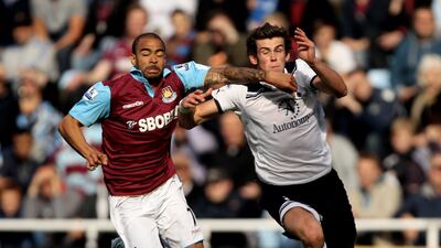 Gareth Bale of Spurs and West Ham's Kieron Dyer compete for the ball during the Premier League match at Upton Park in September 2010. Getty