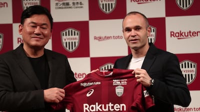 Andres Iniesta, right, alongside Vissel Kobe owner Hiroshi Mikitani during a press conference in Tokyo. Behrouz Mehri / AFP