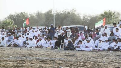 People from children to adults watching bull fighting in Fujairah corniche.