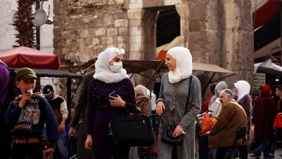 A woman wears a face mask as a preventive measure against the coronavirus, in old Damascus, Syria, on March 9, 2020. REUTERS