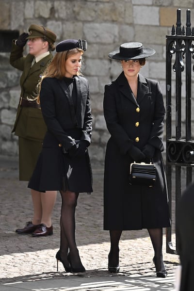 Princess Beatrice and Princess Eugenie leave Westminster Abbey after the state funeral of Queen Elizabeth II. AFP