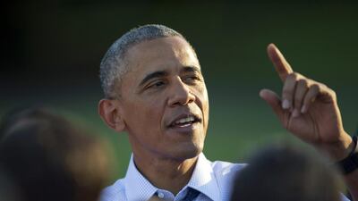 President Barack Obama stops to greet guests at a picnic held for members of Congress. Pablo Martinez Monsivais / AP Photo
