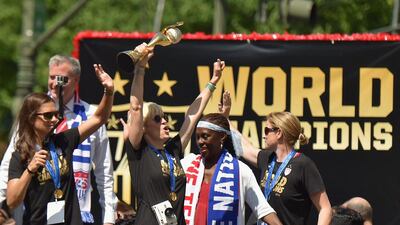Football players Carli Lloyd and Megan Rapinoe in the New York City Ticker Tape Parade for World Cup Champions U.S. Women's football team. Michael Loccisano / Getty Images