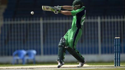 Ireland's Ed Joyce hits a four run hit against the UAE during their World Cricket League Championship at the Sharjah Cricket Stadium. Christopher Pike / The National