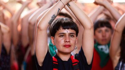 Dafne Valdes, from the feminist collective LasTesis performs the choreography 'A rapist in your path', together with a group of women, in Santiago, Chile. EPA