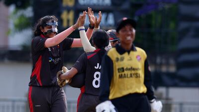 Esha Oza of the UAE celebrates the wicket of Wan Julia of Malaysia in Sylhet.