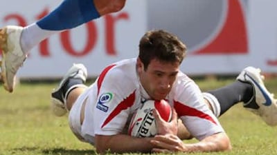 Tom Guest of England races away to score a try during the Dubai Rugby Sevens tournament in 2007.