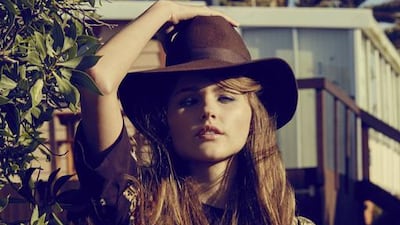 FREE SPIRIT: Hat, Saint Laurent. Dress, Dolce & Gabbana.