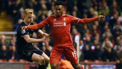 Burnley's English defender Ben Mee (L) vies with Liverpool's English striker Daniel Sturridge during the English Premier League football match between Liverpool and Burnley at Anfield in Liverpool, north west England on March 4, 2015. AFP PHOTO / PAUL ELLIS
