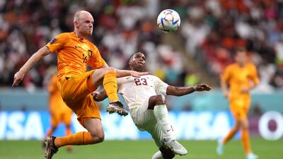 Dutch midfielder Davy Klaassen battles for the ball with Assim Madibo of Qatar. Getty