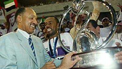 Mohamed Bin Hammam presents the AFC Champions League trophy to the Al Ain captain Salem Jahwar Salmeen after the UAE side won the competition in Bangkok in 2003.
