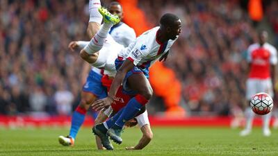 Nacho Monreal of Arsenal is upended by Yannick Bolasie of Crystal Palace during the Premier League match between Arsenal and Crystal Palace at the Emirates Stadium on April 17, 2016 in London, England. (Photo by Paul Gilham/Getty Images)