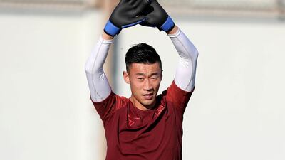 Zhang Lu trains before the start of the Asian Cup at Al Wahda Academy in Abu Dhabi.