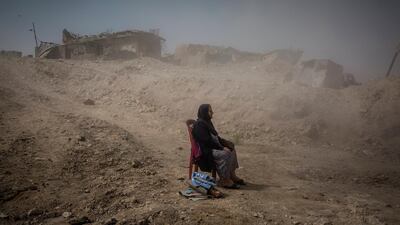 Ivor Prickett claimed the top spot in the 'General News - Stories' category. His picture shows Nadhira Aziz as she looked on as Iraqi Civil Defence workers dug out the bodies of her sister and niece from her house in the Old City where they were killed by an airstrike in Mosul. EPA/IVOR PRICKETT/NEW YORK TIMES