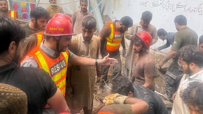 Rescue workers search for survivors after a school roof collapsed in Peshawar, Pakistan, killing many children. Reuters