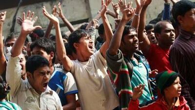 Bangladesh garment workers protest today for justice after a factory fire killed 112 people yesterday.