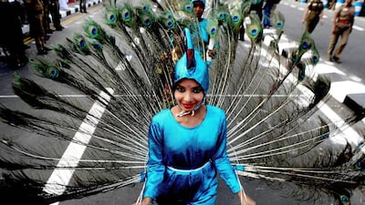 Indian school students perform the ‘mayillattam’ Peacock Dance during a Republic Day parade in Chennai. Arun Sankar / AFP Photo