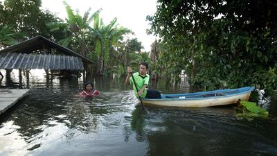 A Thai man paddles in a canoe in Nakhon Si Thammarat. Tuwaedaniya Meringing / AFP Photo