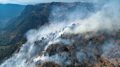 Smoke rises above Jird Meshmesh, in Lebanon’s Akkar region. Khaled Taleb for The National
