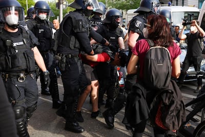 Police officers detain a protester during a demonstration in support of Palestinians in Berlin. Reuters