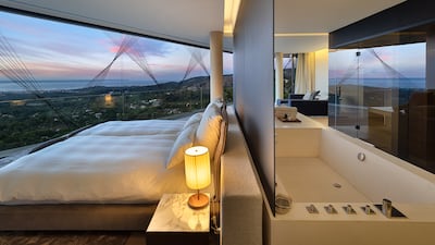 A bedroom with panoramic views of the Balearic island's coast.