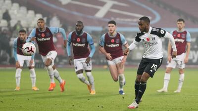 Fulham's Ademola Lookman runs up to take the penalty. AP