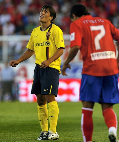 Barcelona's Bojan Krkic, left, reacts after missing a chance against newly-promoted Numancia. AP Photo