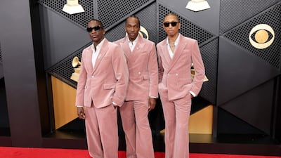 Malice and Pusha T of Clipse and Pharrell Williams in co-ordinated pink. AFP