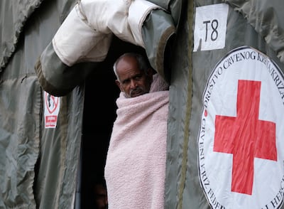 A migrant walks through the Lipa camp, outside Bihac, Bosnia. Thousands of migrants, including many Afghans, are stranded in Bosnia and other Balkan countries while trying to reach wealthy European nations in search of a better future. Photo: AP