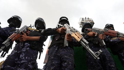 Houthi troopers stand guard during a protest against Saudi Arabia, in Sanaa, Yemen, in July. EPA