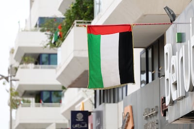Residents and businesses alike answered the call to display the UAE flag as a symbol of strength and solidarity. Chris Whiteoak / The National