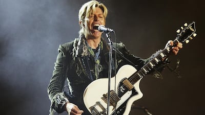 You can learn to play classic David Bowie tunes on guitar through free online courses by instrument makers Fender. Getty Images
