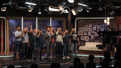 Ahmed Al Basheer (centre in a suit), 32, and actors working for his Al Basheer Show record the weekly satirical TV programme in Amman on May 11, 2017. Sebastian Castelier