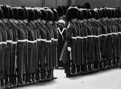 Sultan Qaboos inspecting a guard of honour in London in 1982. Getty Images
