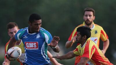 Rob Buaserau of Abu Dhabi is tackled by Imad Reyal of Dubai during the Bill McLaren Foundation Charity Match. Francois Nel / Getty Images